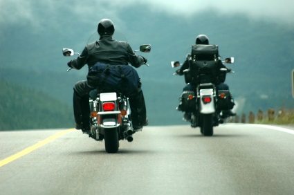 two motorcyclists driving