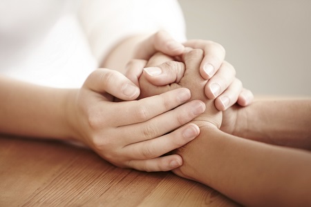 wrongful death family holding hands