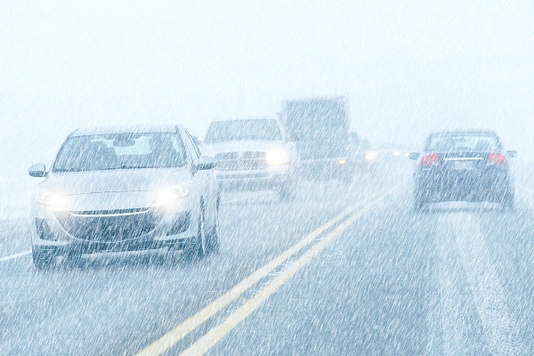 Cars on a highway in a heavy snowfall