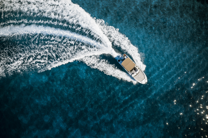 A top down view of a boat traveling across the water.