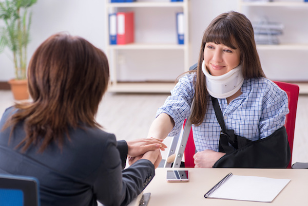 Image of injured woman and her lawyer