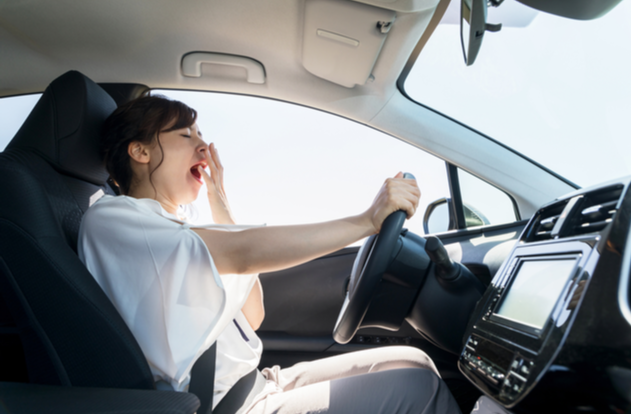 yawning female driver. yawning female driver.