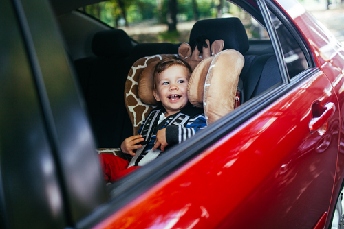 Adorable baby boy in safety car seat. Adorable baby boy in safety car seat.