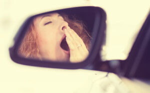 view reflection sleepy tired exhausted young woman driving